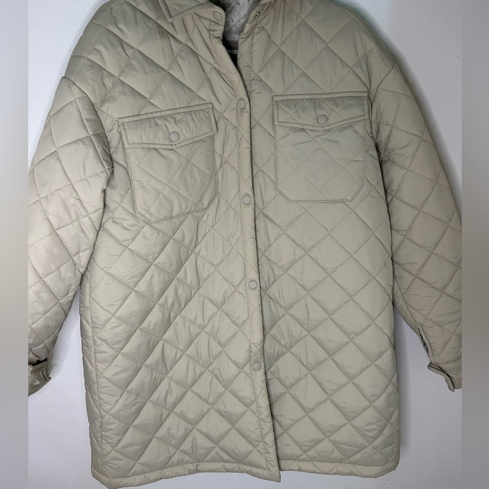 padded coat, with pocket.  cream color, long and comfortable